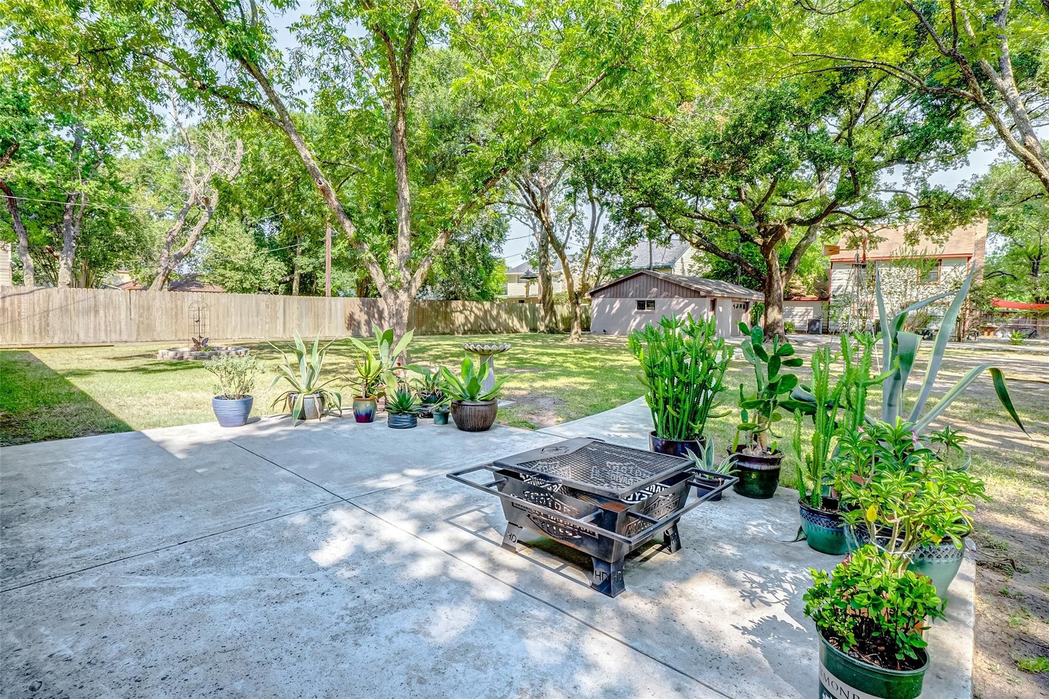 9218 Hammerly Boulevard Houston, TX 77080 - Photo 33 of 40 a bench sitting in middle of a yard