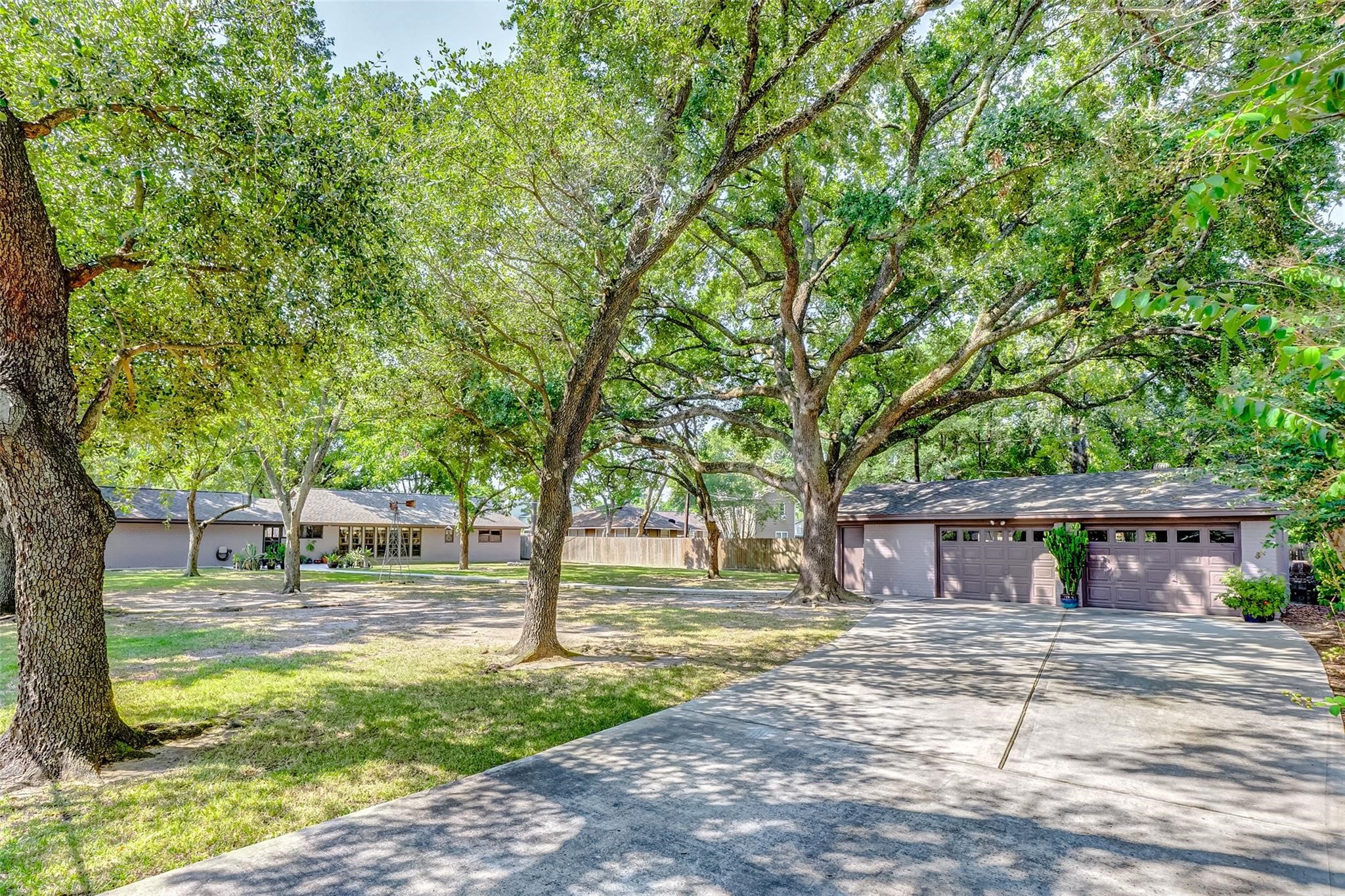 9218 Hammerly Boulevard Houston, TX 77080 - Photo 39 of 40 a front view of a house with a yard and trees