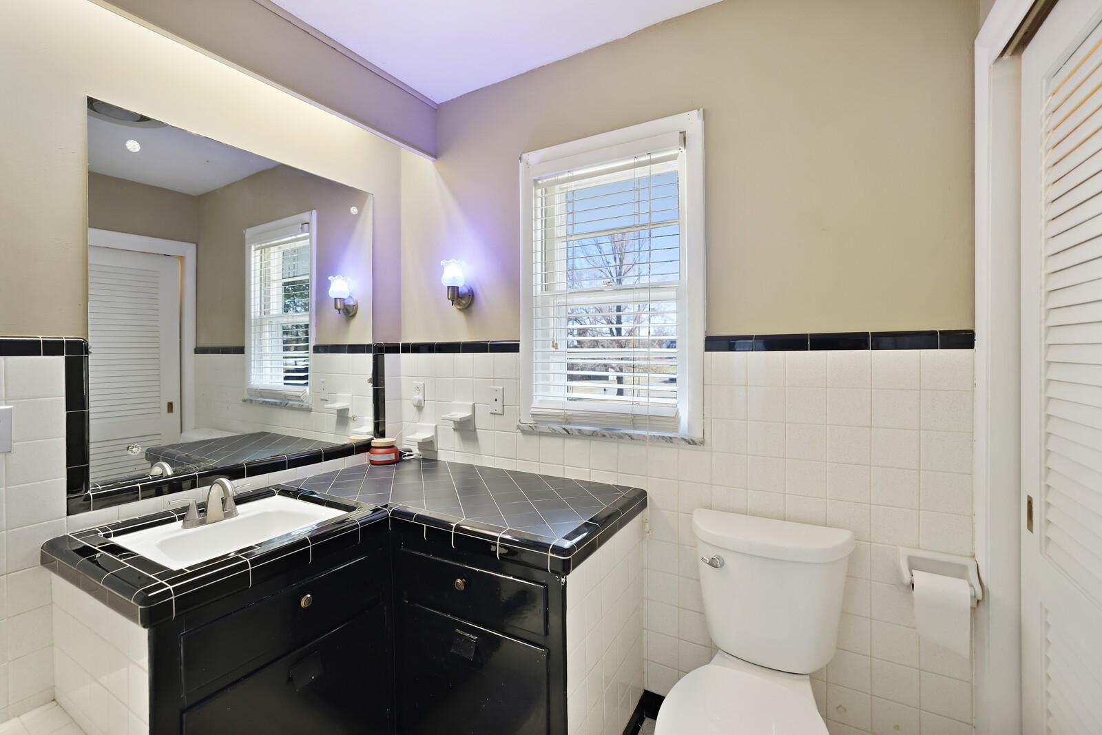 676 Ferguson Hill Road Lafayette, TN 37083 - Photo 45 of 89 a bathroom with a granite countertop sink toilet and mirror
