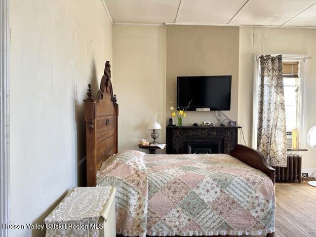 22 Liberty Street Catskill, NY 12414 - Photo 21 of 30 a bedroom with a bed and a flat tv screen on dresser