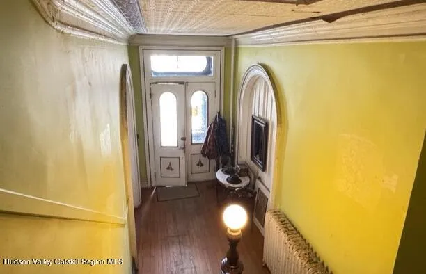 a view of front door with wooden floor