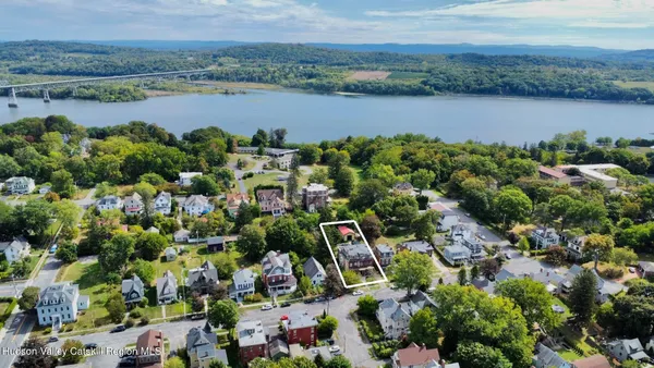 an aerial view of a city and lake view