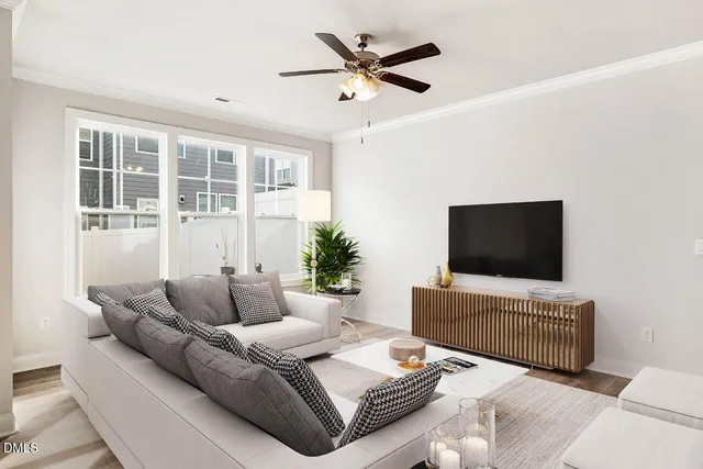 a living room with furniture and a flat screen tv