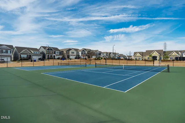 a view of an outdoor space and tennis court