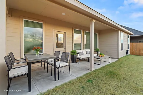 a view of a backyard of a house