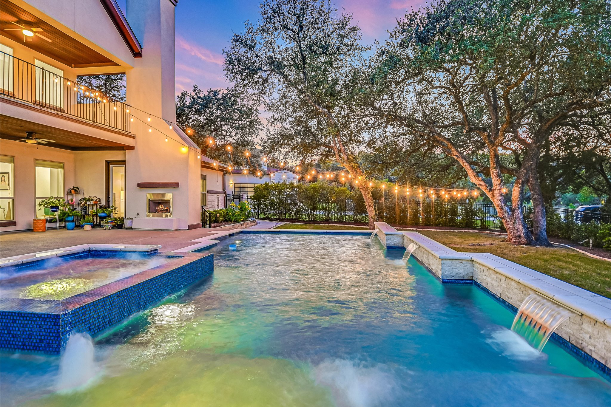 2625 Arion Circle Austin, TX 78730 - Photo 12 of 32 View of pool with a ceiling fan, a pool with connected hot tub, and a patio area