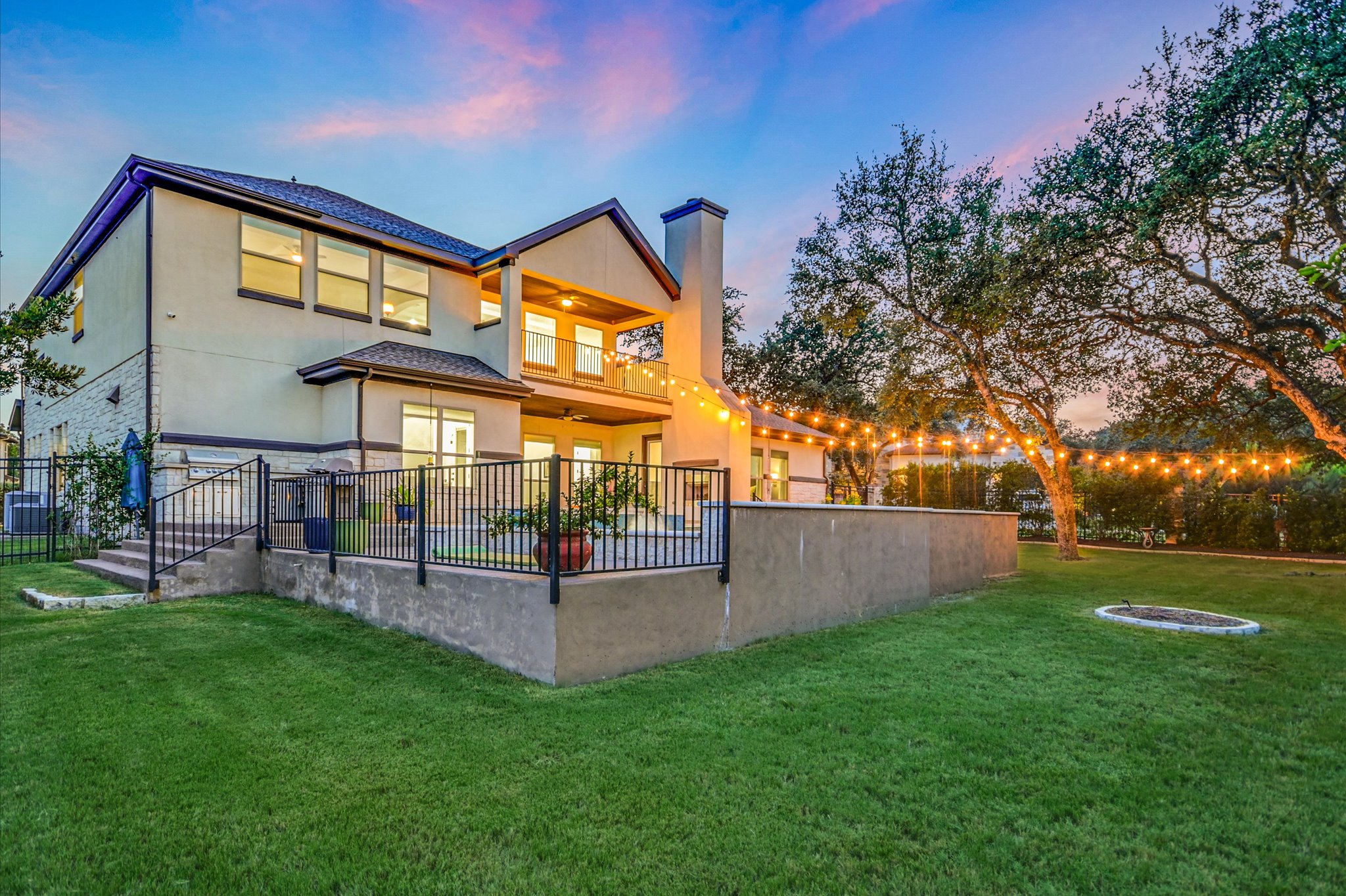 2625 Arion Circle Austin, TX 78730 - Photo 2 of 32 Back of property featuring a chimney, a balcony, and stucco siding