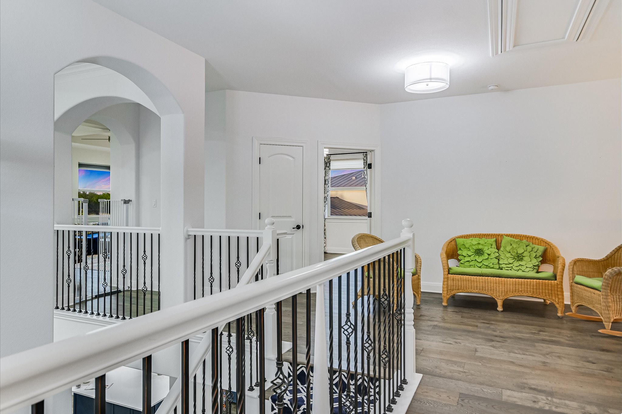 2625 Arion Circle Austin, TX 78730 - Photo 22 of 32 Corridor featuring wood finished floors and an upstairs landing