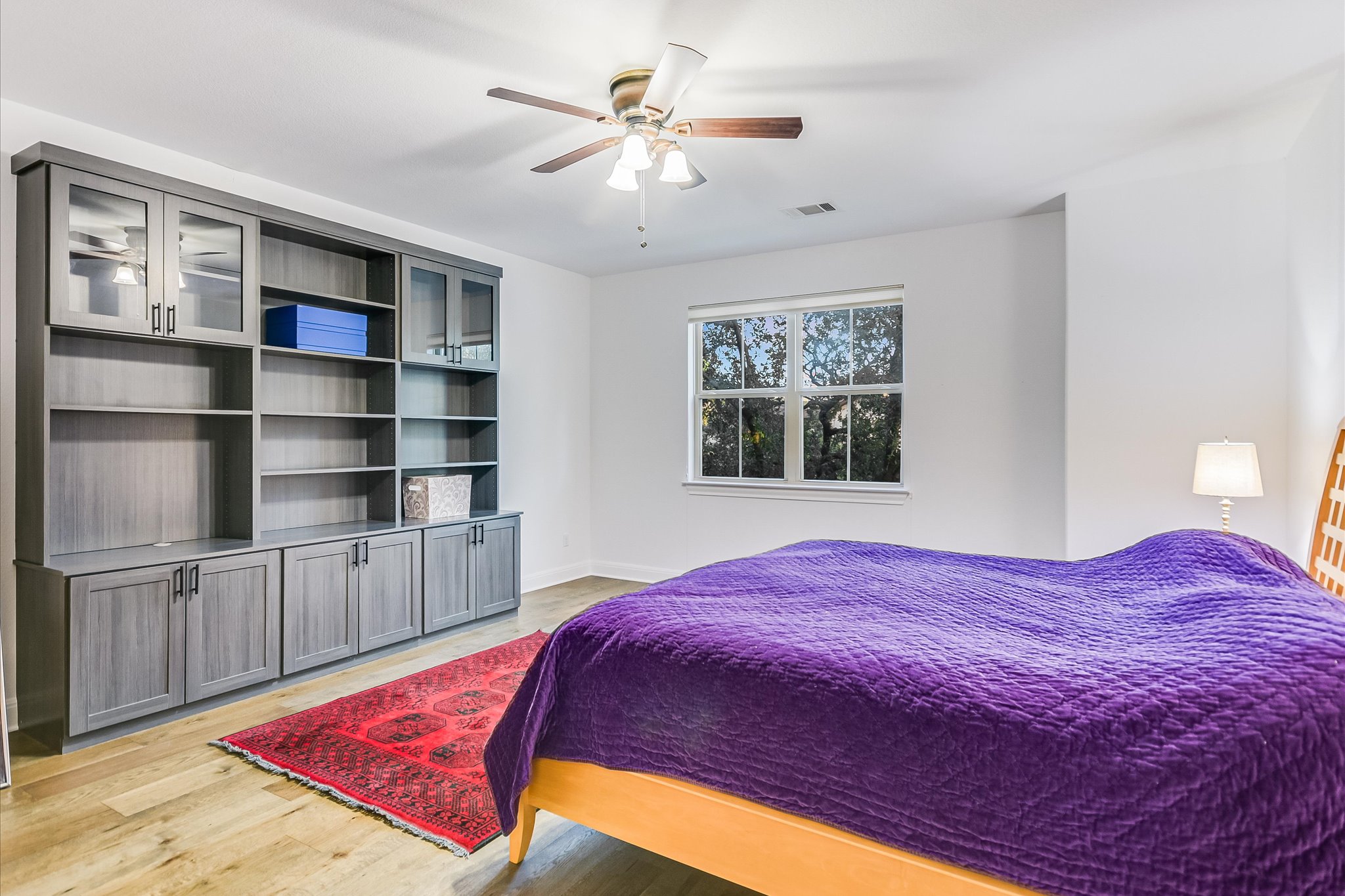 2625 Arion Circle Austin, TX 78730 - Photo 23 of 32 Bedroom with light wood-type flooring and a ceiling fan