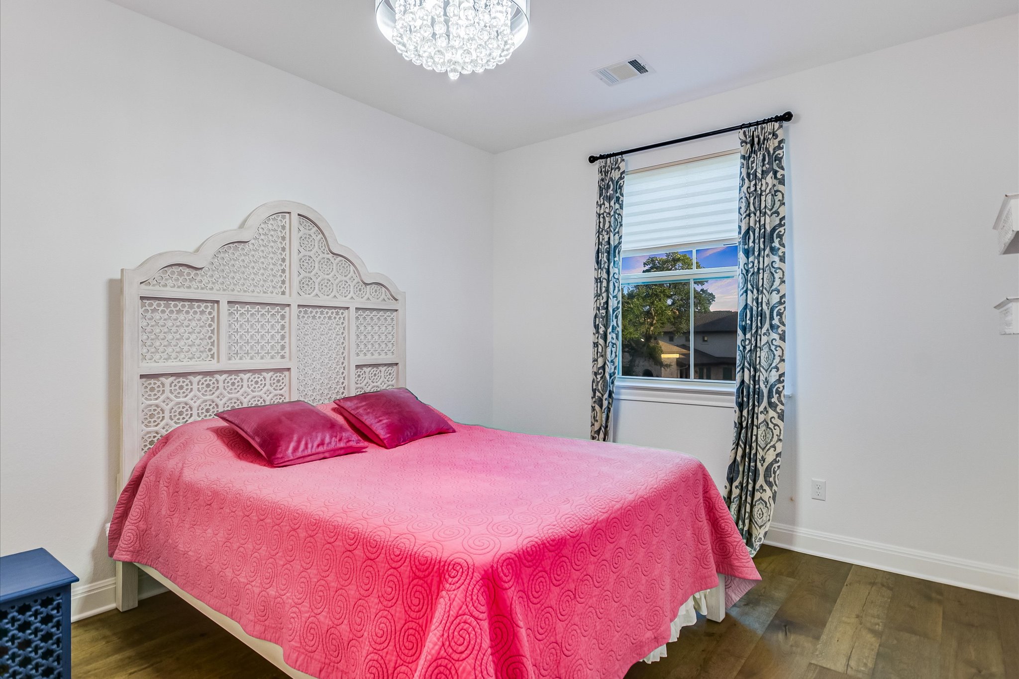 2625 Arion Circle Austin, TX 78730 - Photo 25 of 32 Bedroom featuring wood finished floors and a chandelier