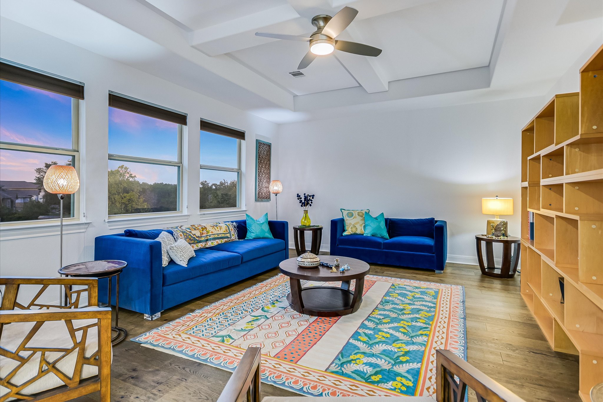 2625 Arion Circle Austin, TX 78730 - Photo 9 of 32 Living room featuring wood finished floors, ceiling fan, beam ceiling, and a raised ceiling