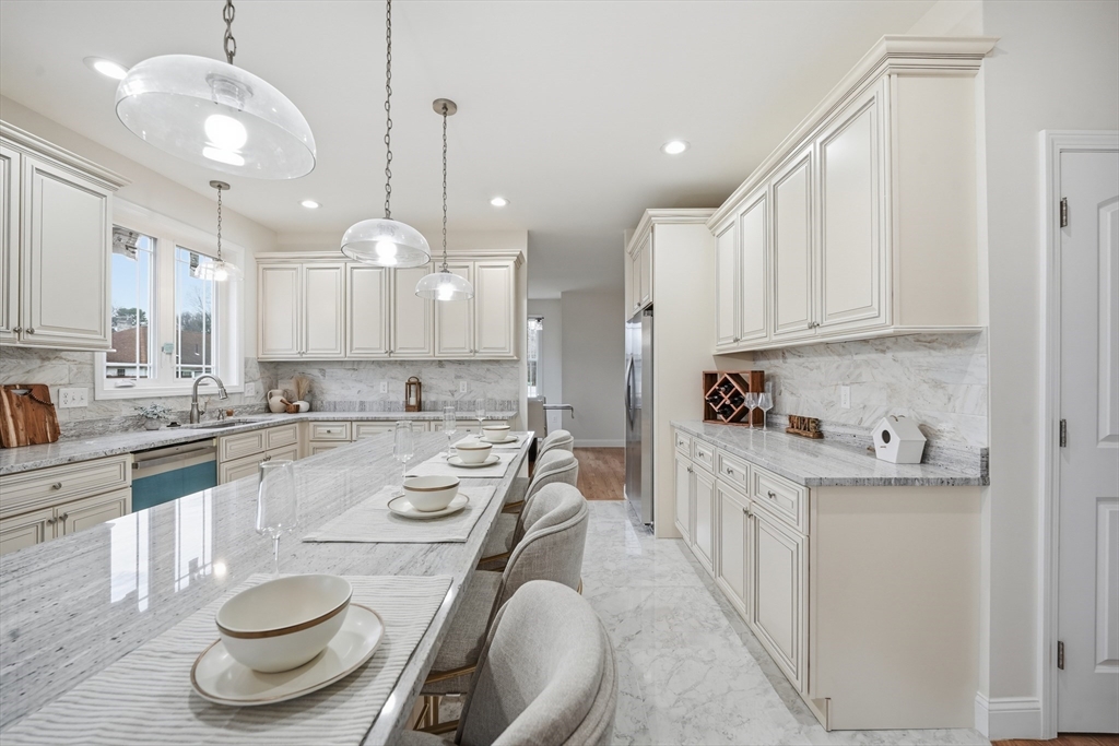 110 West Crystal Brook Drive Springfield, MA 01118 - Photo 15 of 40 a kitchen with sink a stove and cabinets
