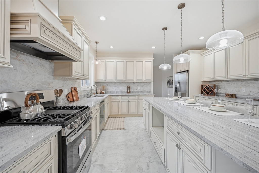 110 West Crystal Brook Drive Springfield, MA 01118 - Photo 16 of 40 a kitchen with a sink stove and cabinets