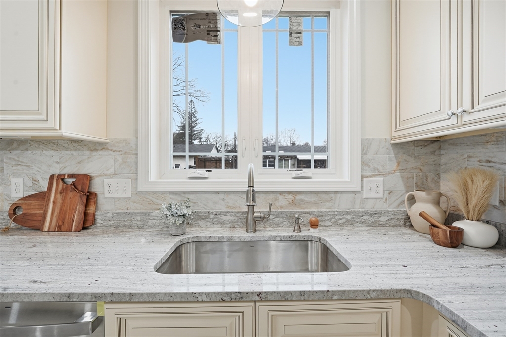 110 West Crystal Brook Drive Springfield, MA 01118 - Photo 18 of 40 a kitchen with sink and cabinets