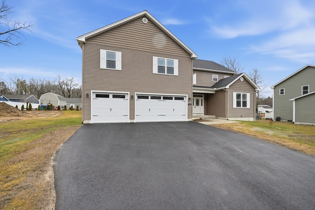 110 West Crystal Brook Drive Springfield, MA 01118 - Photo 2 of 40 a view of a house with a yard