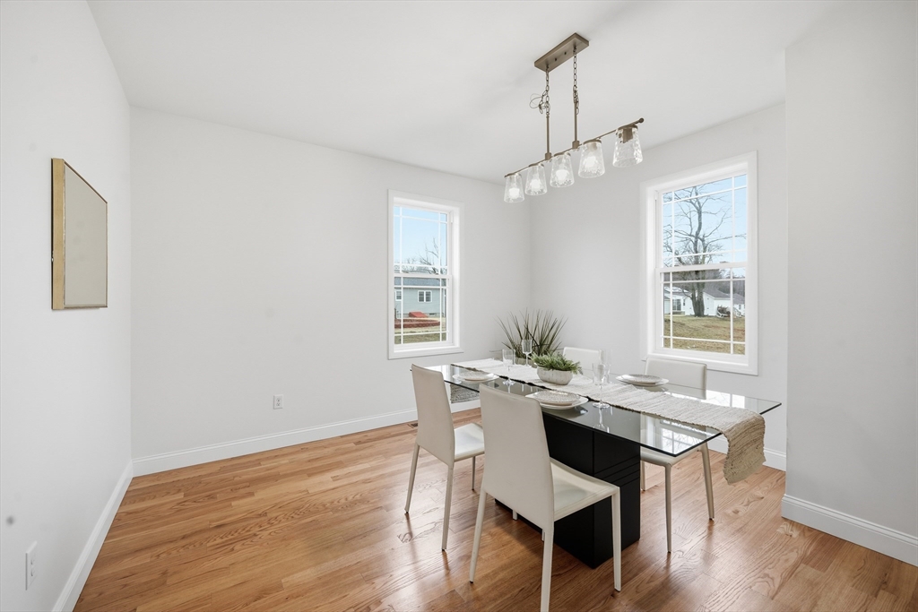 110 West Crystal Brook Drive Springfield, MA 01118 - Photo 21 of 40 a view of a dining room with furniture window and wooden floor