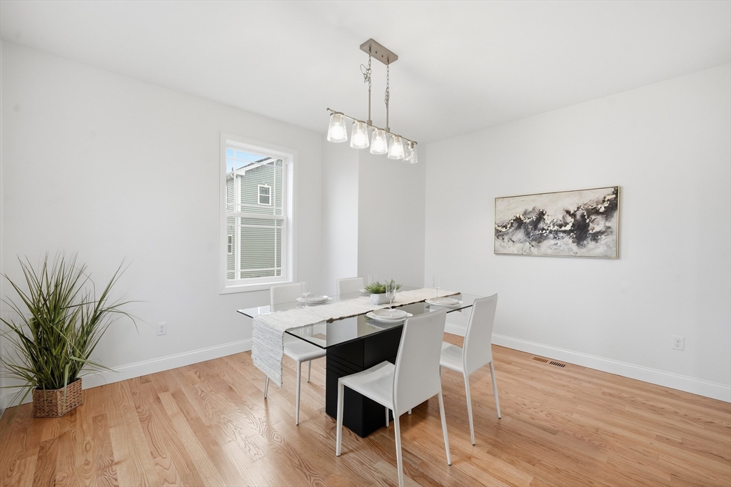 110 West Crystal Brook Drive Springfield, MA 01118 - Photo 22 of 40 a view of a dining room with furniture window and wooden floor