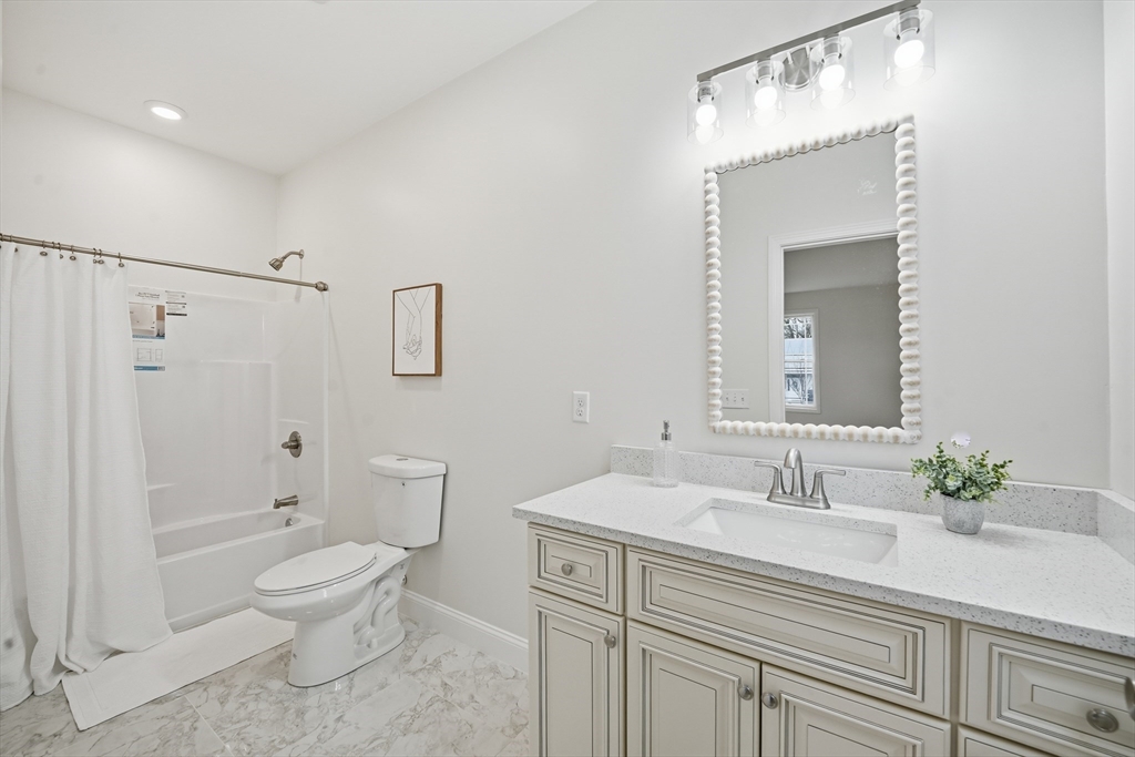 110 West Crystal Brook Drive Springfield, MA 01118 - Photo 25 of 40 a bathroom with a sink a toilet and shower