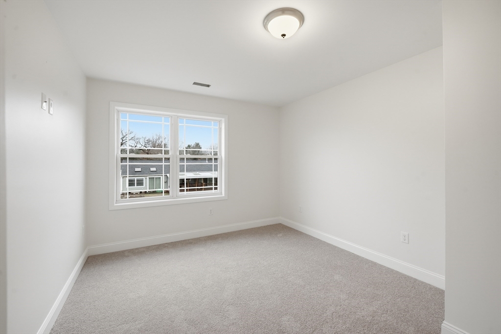 110 West Crystal Brook Drive Springfield, MA 01118 - Photo 28 of 40 an empty room with a window