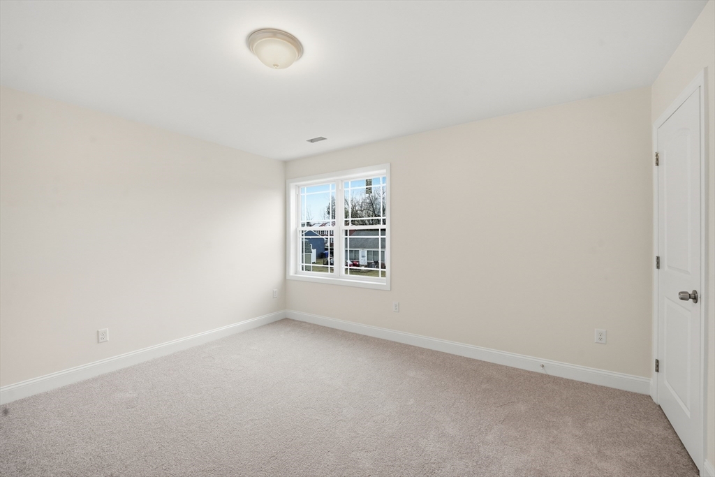 110 West Crystal Brook Drive Springfield, MA 01118 - Photo 32 of 40 an empty room with a empty space and windows