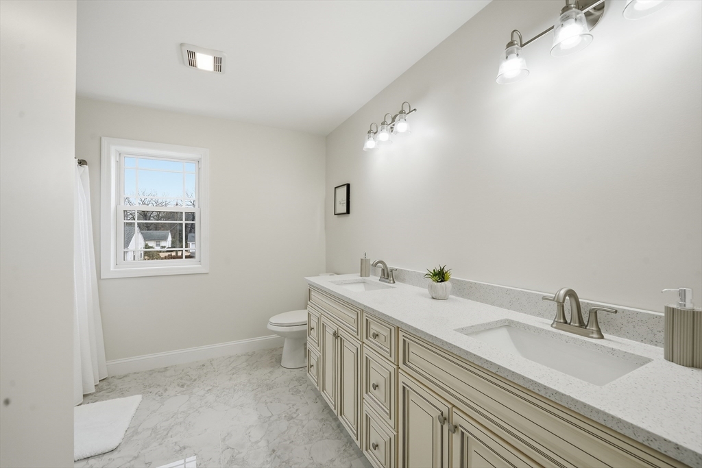 110 West Crystal Brook Drive Springfield, MA 01118 - Photo 33 of 40 a bathroom with double sink and a mirror