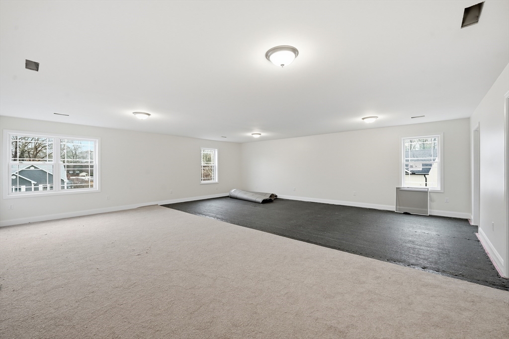 110 West Crystal Brook Drive Springfield, MA 01118 - Photo 35 of 40 en empty room with windows and pillars in it