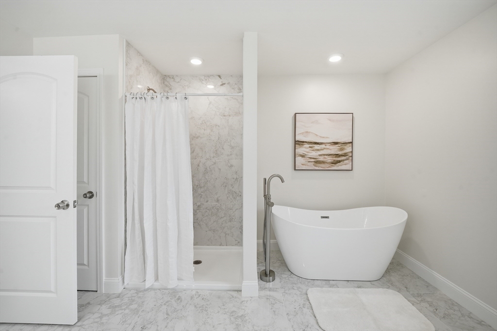 110 West Crystal Brook Drive Springfield, MA 01118 - Photo 40 of 40 a view of a bathroom with a bathtub and shower
