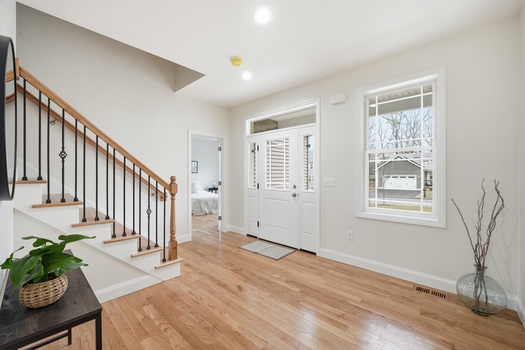 110 West Crystal Brook Drive Springfield, MA 01118 - Photo 6 of 40 a view of entryway with wooden floor and stairs