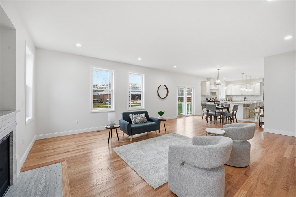 110 West Crystal Brook Drive Springfield, MA 01118 - Photo 10 of 40 a living room with furniture and a wooden floor