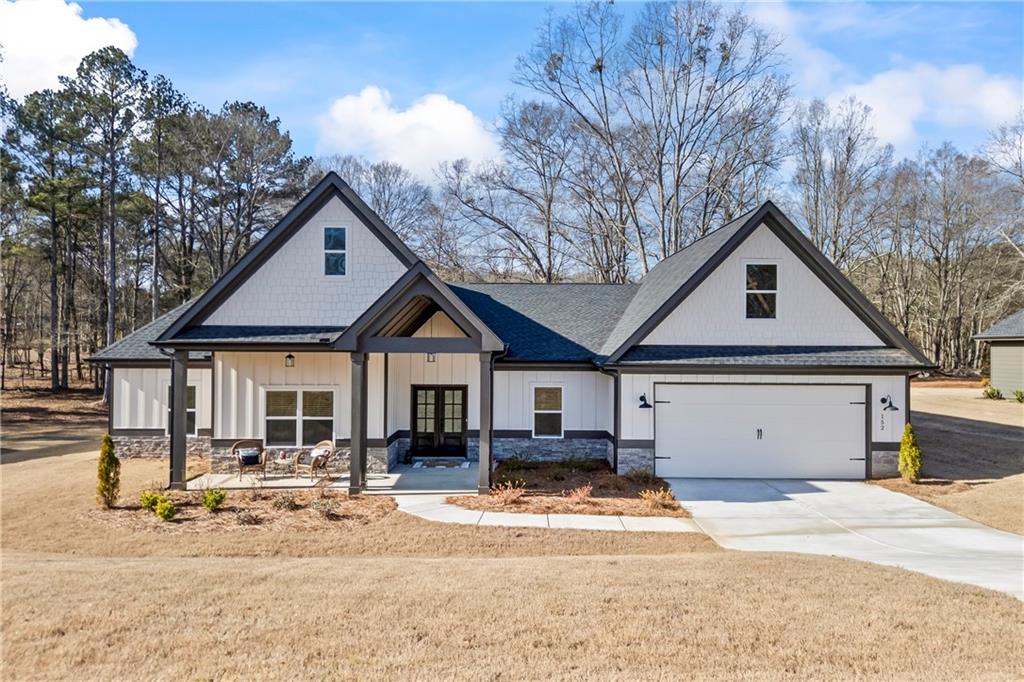 152 White Oak Way Monroe, GA 30655 - Photo 1 of 65 a front view of a house with a yard and garage