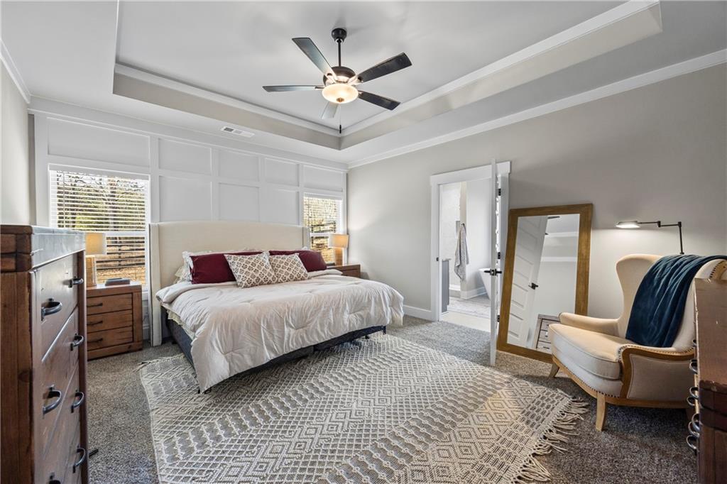 152 White Oak Way Monroe, GA 30655 - Photo 18 of 65 a spacious bedroom with a bed and a couch