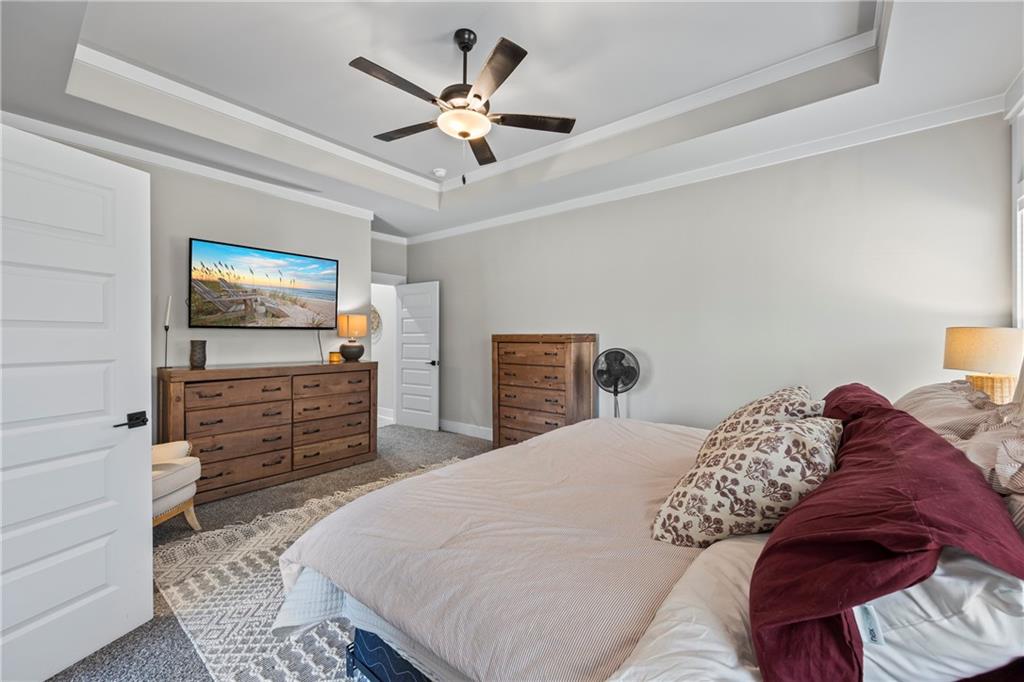 152 White Oak Way Monroe, GA 30655 - Photo 19 of 65 a bedroom with a bed and a flat screen tv