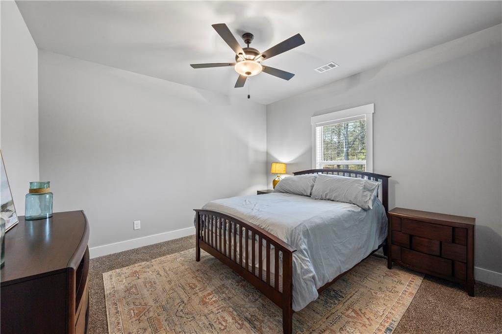 152 White Oak Way Monroe, GA 30655 - Photo 29 of 65 a bedroom with a bed and window