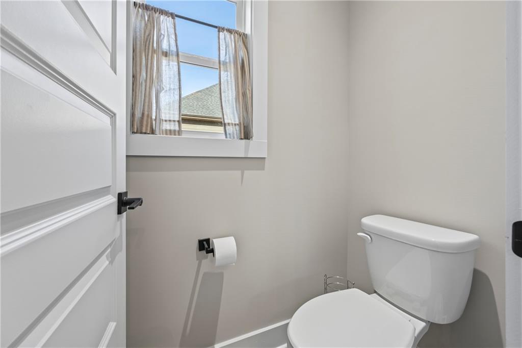 152 White Oak Way Monroe, GA 30655 - Photo 32 of 65 a white toilet sitting next to a window