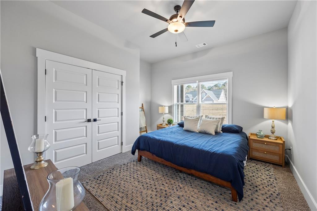 152 White Oak Way Monroe, GA 30655 - Photo 33 of 65 a bedroom with a bed and a window
