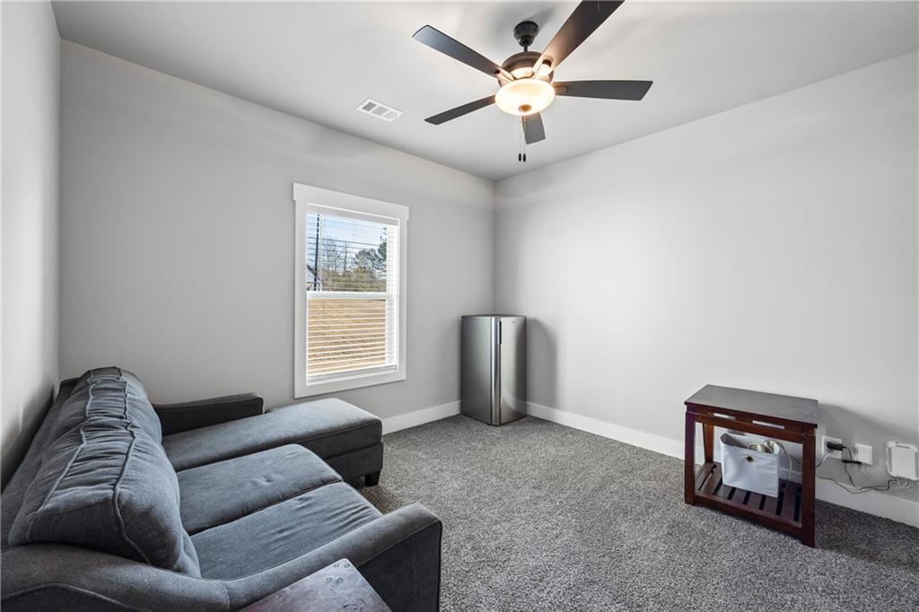 152 White Oak Way Monroe, GA 30655 - Photo 36 of 65 a living room with furniture and a window