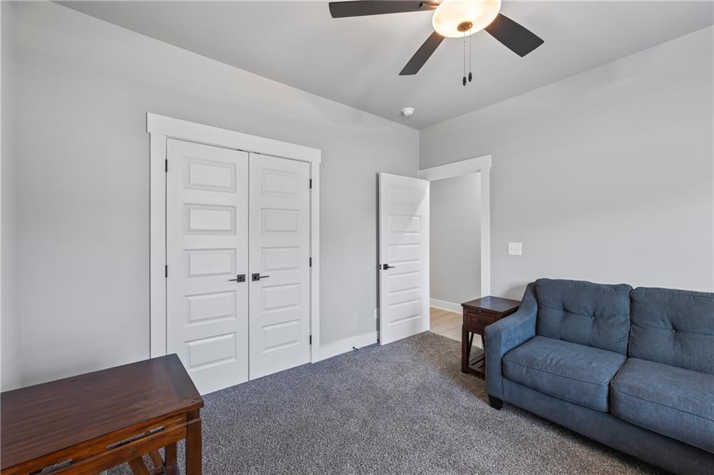 152 White Oak Way Monroe, GA 30655 - Photo 37 of 65 a living room with furniture and a ceiling fan
