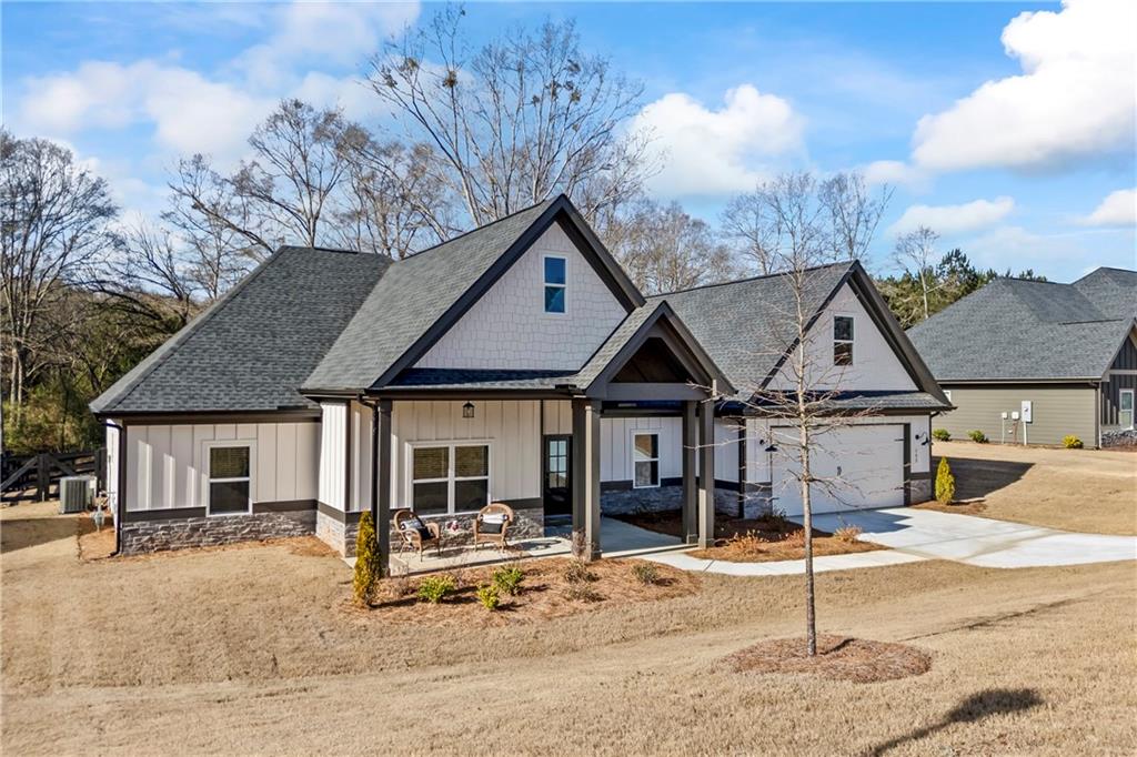 152 White Oak Way Monroe, GA 30655 - Photo 49 of 65 a front view of a house with garden