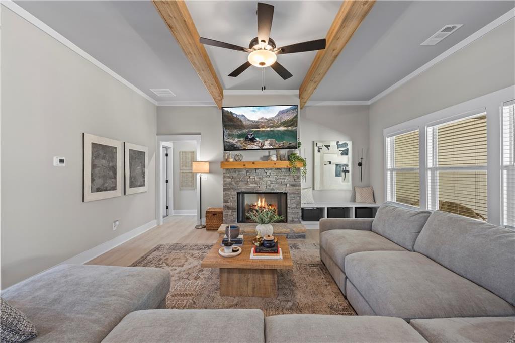 152 White Oak Way Monroe, GA 30655 - Photo 5 of 65 a living room with furniture fireplace and a large window