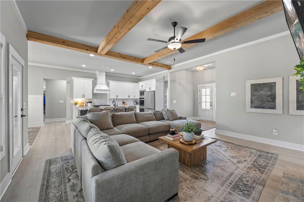 152 White Oak Way Monroe, GA 30655 - Photo 8 of 65 a living room with furniture and a chandelier