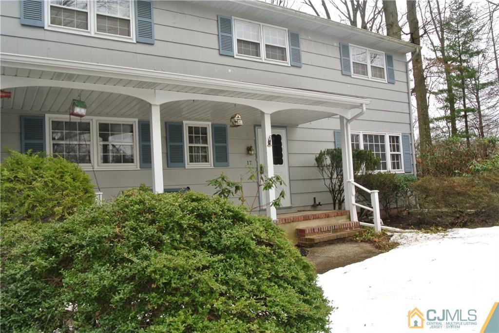 17 Woodruff Road Edison, NJ 08820 - Photo 2 of 25 front view of a brick house with a small yard