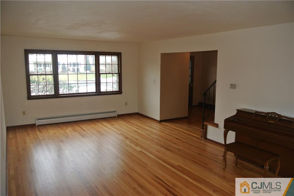 17 Woodruff Road Edison, NJ 08820 - Photo 12 of 25 a view of an empty room with wooden floor and a window