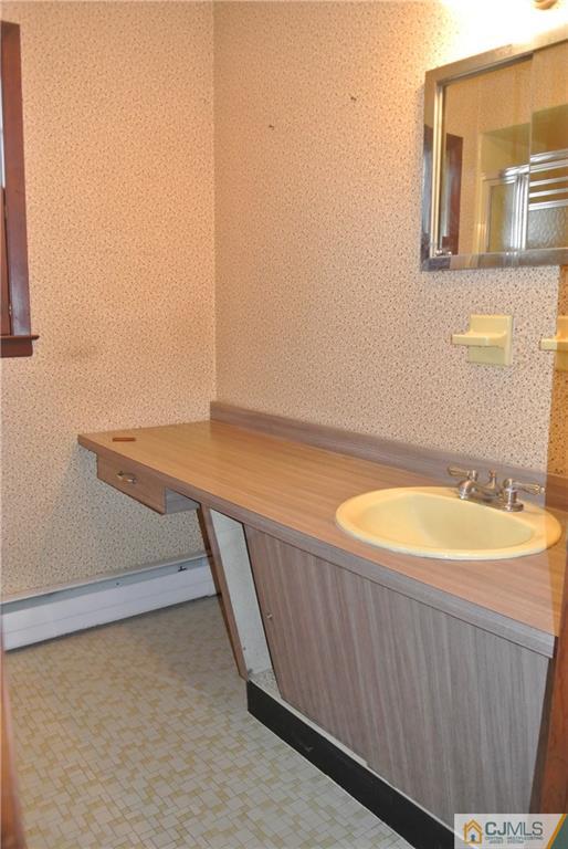 17 Woodruff Road Edison, NJ 08820 - Photo 20 of 25 a bathroom with a sink and a bathtub