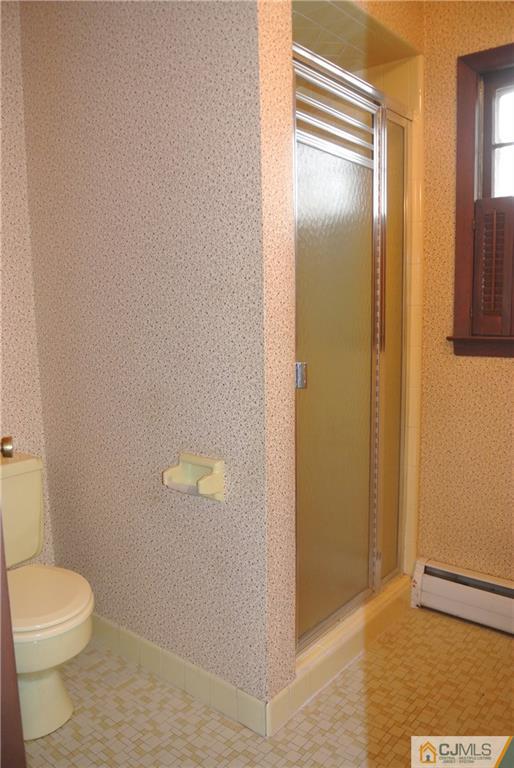 17 Woodruff Road Edison, NJ 08820 - Photo 21 of 25 a bathroom with a toilet and a shower
