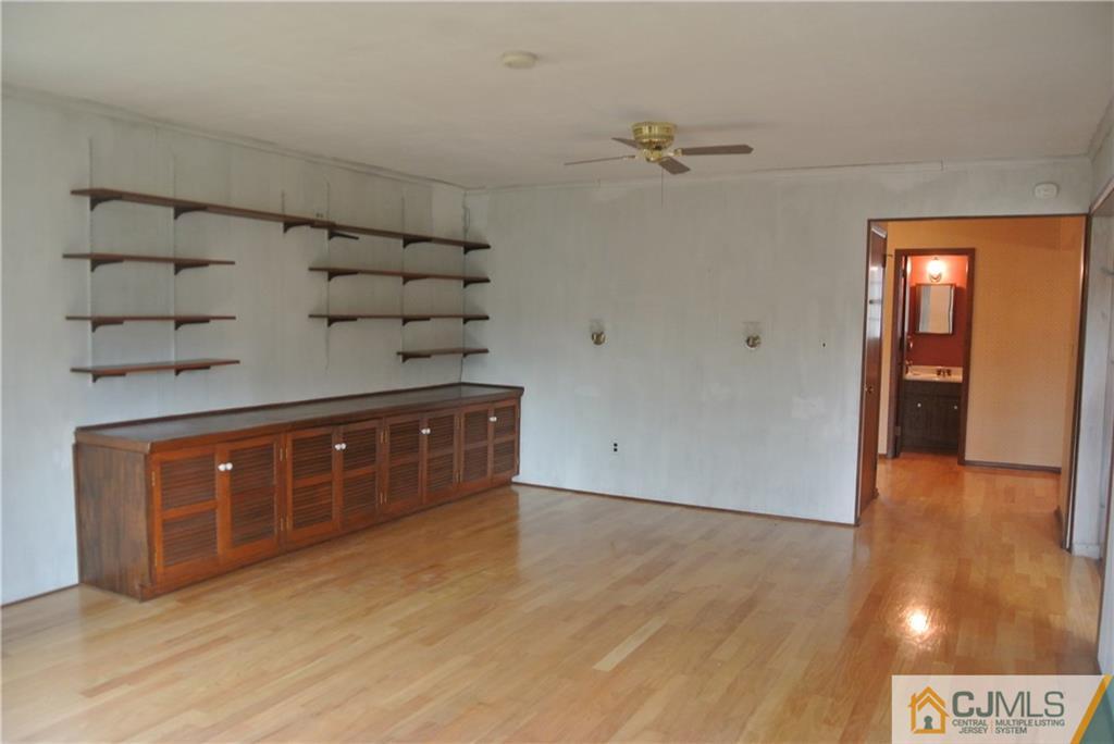 17 Woodruff Road Edison, NJ 08820 - Photo 6 of 25 a room with a wooden floor and utility room