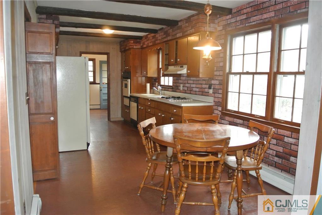 17 Woodruff Road Edison, NJ 08820 - Photo 7 of 25 a view of a dining room with furniture and wooden floor