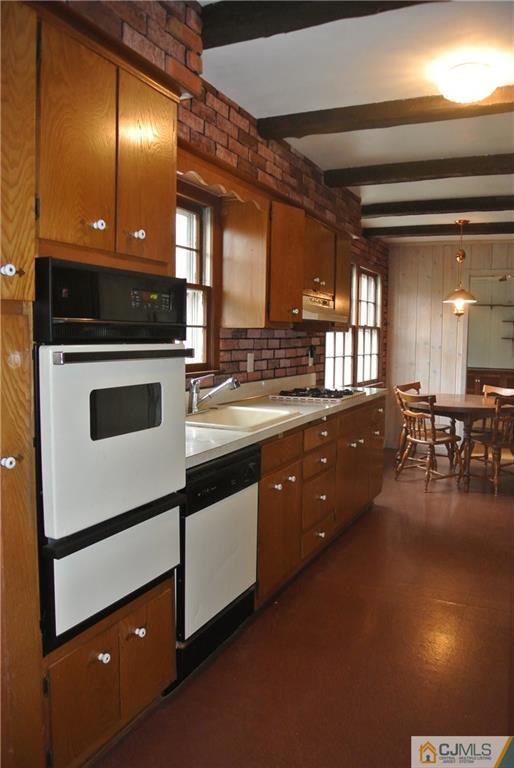 17 Woodruff Road Edison, NJ 08820 - Photo 8 of 25 a kitchen with stainless steel appliances granite countertop a stove a sink and a microwave