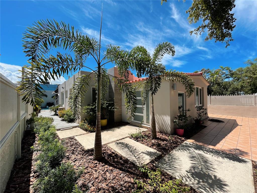 a view of a house with a yard