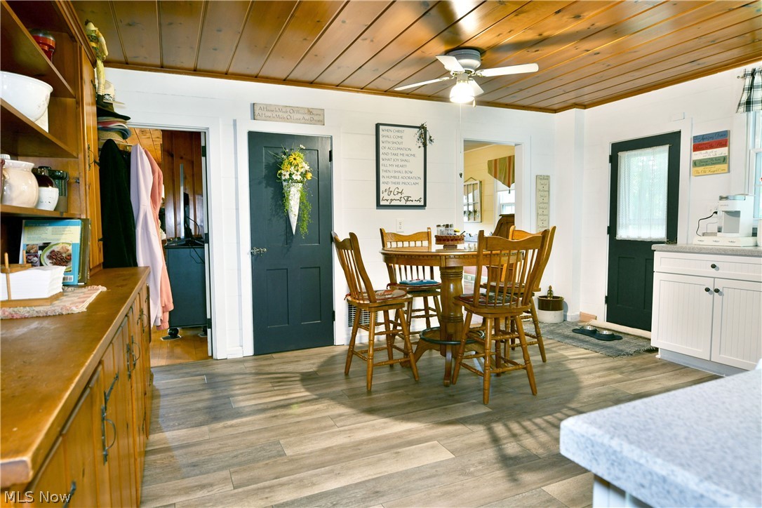 8683 King Graves Road Northeast Warren, OH 44484 - Photo 5 of 50 Wood-finish flooring throughout, complemented by a wood-plank ceiling