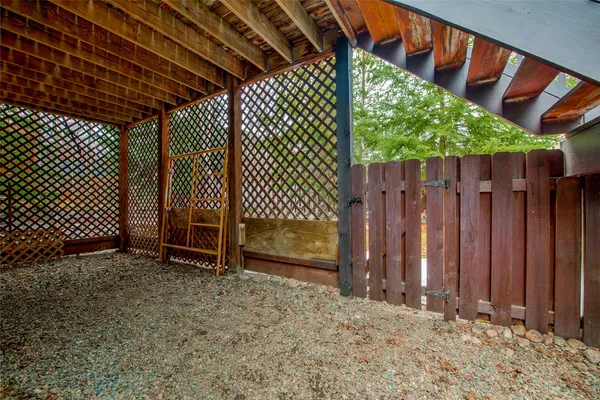 a view of outdoor space with wooden fence